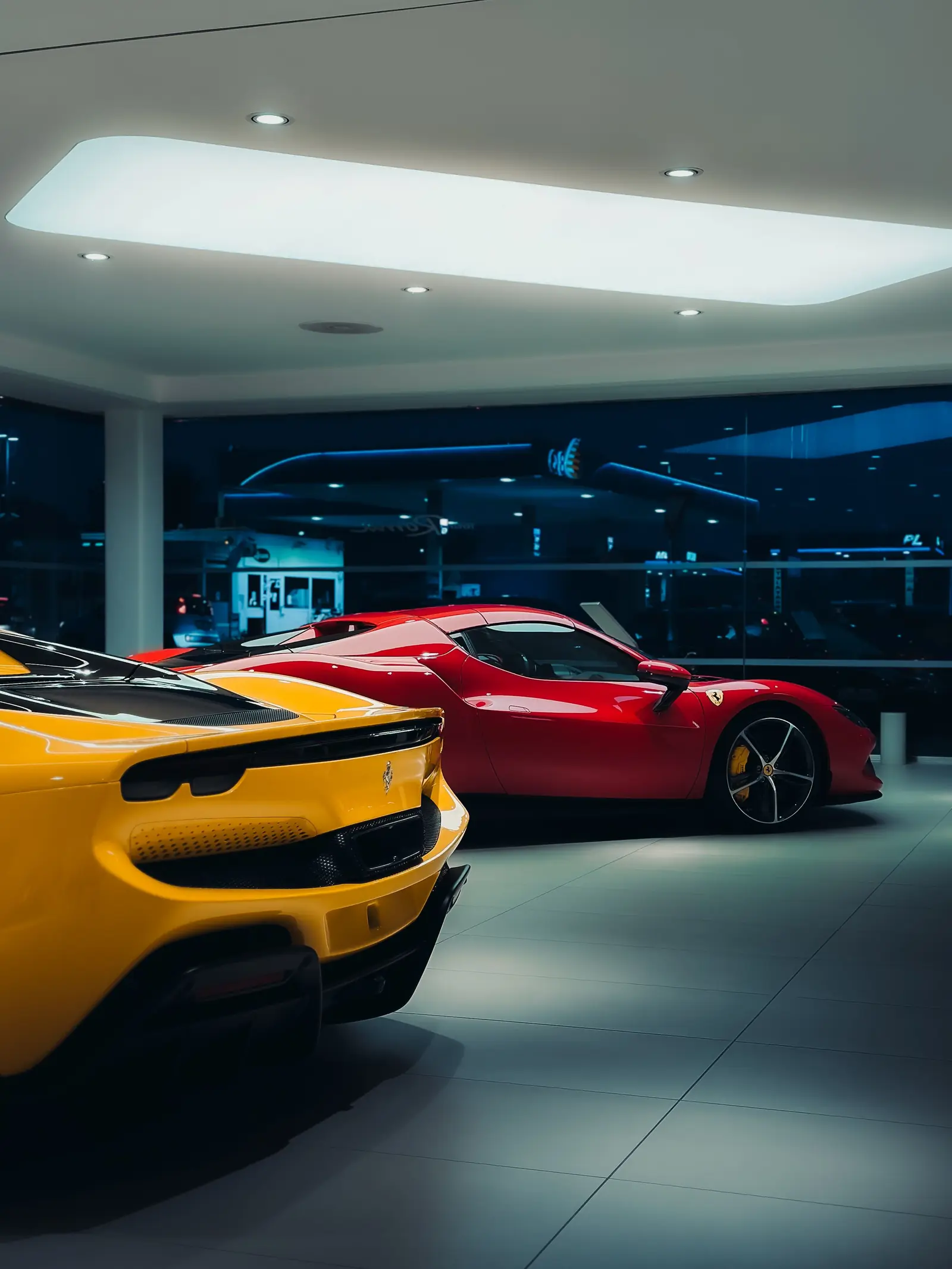Sports cars on a high-gloss showroom floor